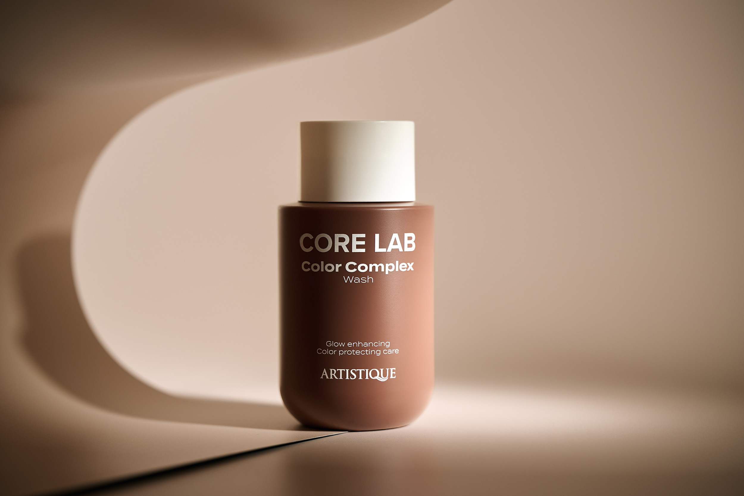 Product photography for Artistique - haircare product with professional styling and elegant presentation